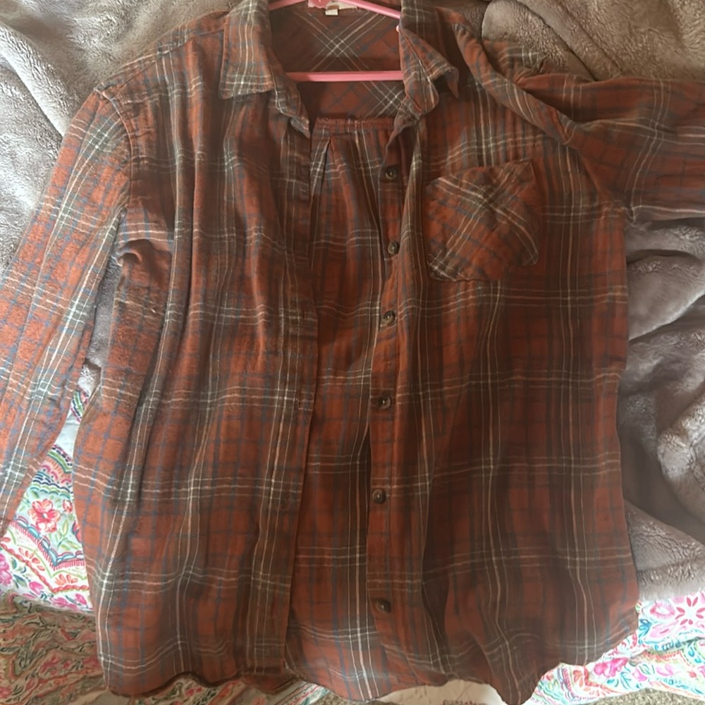 Love Notes, orange flannel, size small. Buttons on the front. Long sleeve.